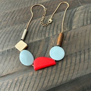 Modern Geometric Necklace with Red and Blue Accents